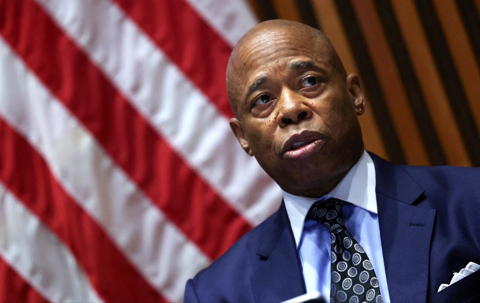 Mayor Eric Adams at an official city event, smiling.